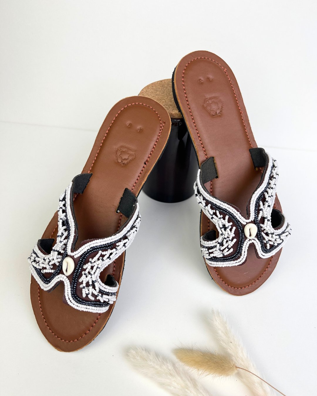 African leather and beaded flip flops